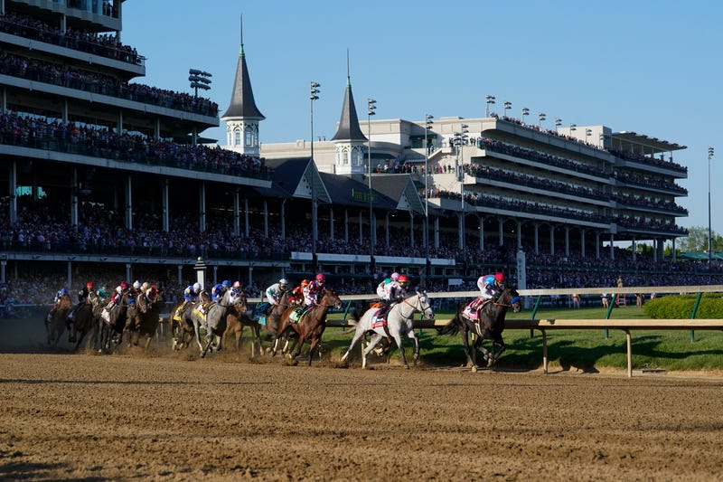 Medina Spirit, right, with John Velazquez aboard, leads the field around the first turn on the way to winning the 147th running of the Kentucky Derby at Churchill Downs, Saturday, May 1, 2021, in Louisville, Ky