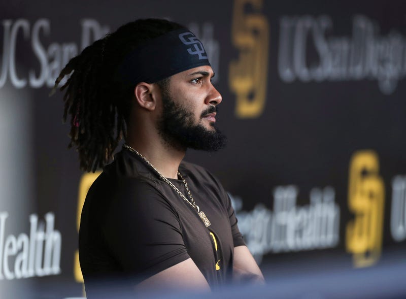 San Diego Padres' Fernando Tatis Jr. looks out from the dugout prior to the team's baseball game against the Philadelphia Phillies on June 25, 2022, in San Diego. Tatis was suspended 80 games by Major League Baseball on Friday, Aug. 12, after testing positive for a performance-enhancing substance. The penalty was effective immediately, meaning the All-Star shortstop cannot play in the majors this year. Tatis had been on the injured list all season after breaking his left wrist in spring training.