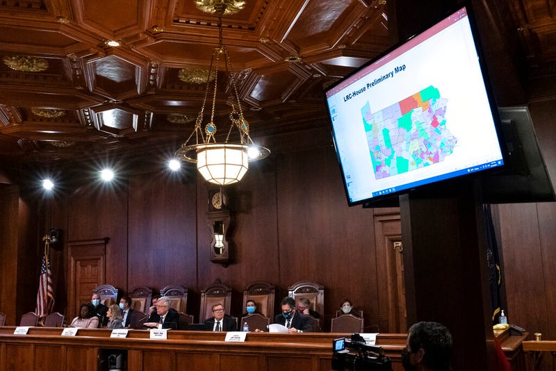 FILE—In this file photo from Dec. 16, 2021, a proposed map is displayed during a meeting of the Pennsylvania Legislative Reapportionment Commission at the Capitol in Harrisburg, Pa. Democrats who have long blamed their party's legislative minorities on Republican gerrymandering will find out in November whether more friendly district maps will edge them closer to retaking control of the House and Senate.