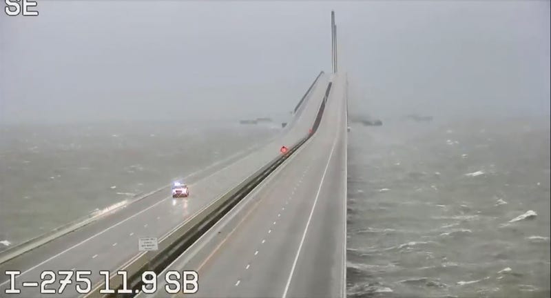This image provided by FLDOT shows an emergency vehicle traveling on the Sunshine Skyway over Tampa Bay, Fla., on Wednesday, Sept. 28, 2022