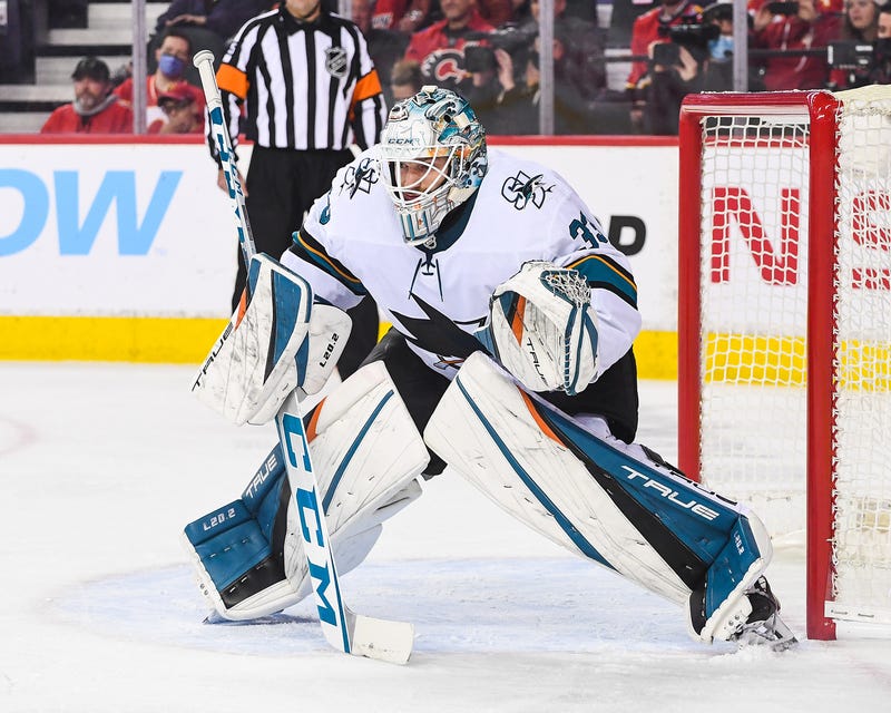 Adin Hill of the San Jose Sharks in action against the Calgary Flames during an NHL game at Scotiabank Saddledome on November 9, 2021 in Calgary, Alberta, Canada.