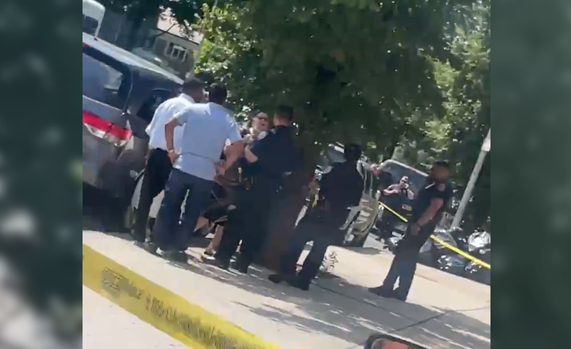 Police gather outside Beth Abraham Hospital where a woman fell to death on Friday.
