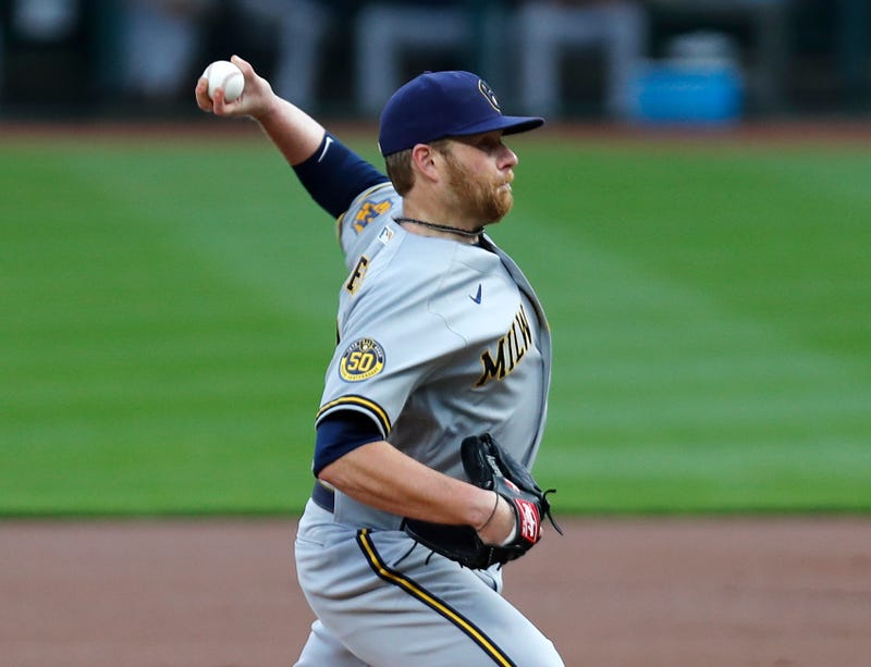 Sep 22, 2020; Cincinnati, Ohio, USA; Milwaukee Brewers starting pitcher Brett Anderson (25) throws against the Cincinnati Reds during the first inning at Great American Ball Park. Mandatory Credit: David Kohl-USA TODAY Sports