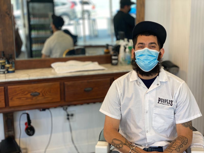 Lead Barber, Juan Sosa, at People's Barber on Polk Street, San Francisco. June 16, 2021.