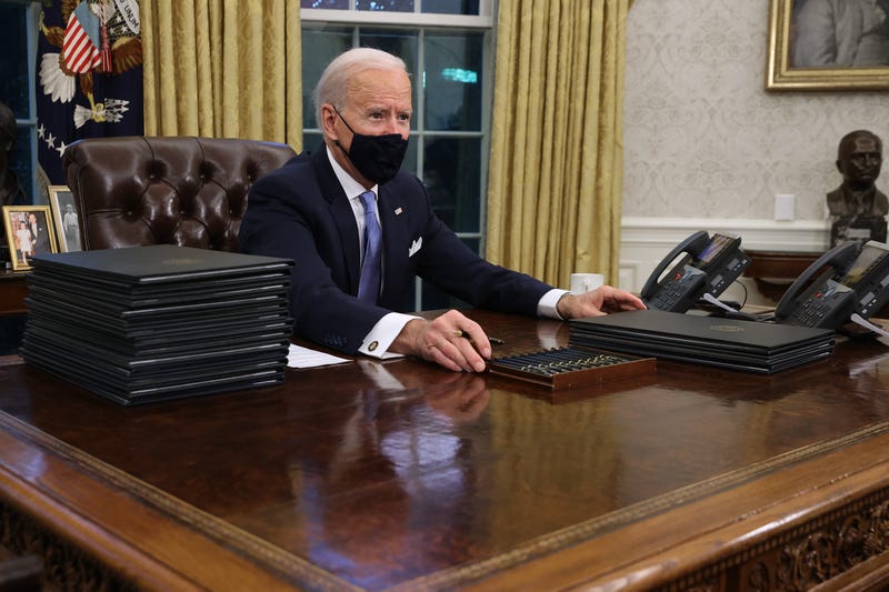 Hours after taking the Oath of Office, President Joe Biden signs a series of executive orders, Jan. 20, 2021.