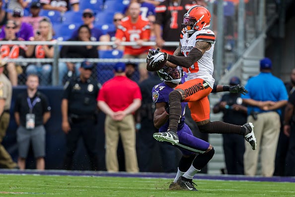 Odell Beckham catches a pass over Marlon Humphrey.