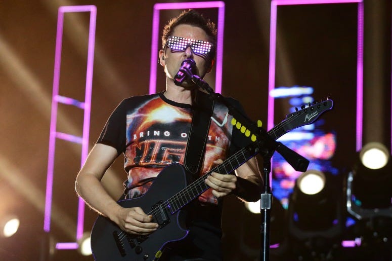 Matt Bellamy of Muse performs on stage during day two of Formula 1 Singapore Grand Prix