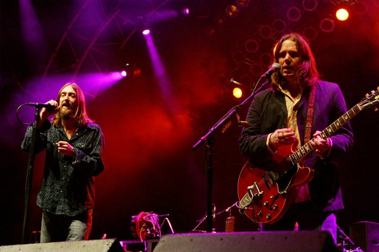 Chris Robinson (L), and his brother, guitarist Rich Robinson of The Black Crowes, perform at the Vegoose music festival