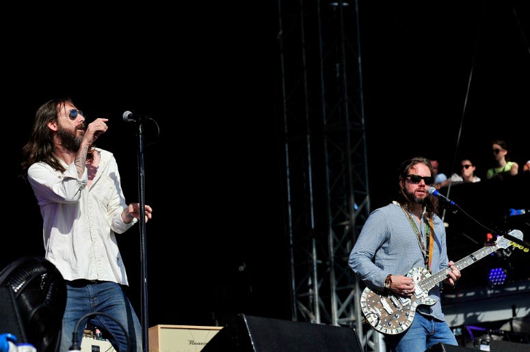 Chris Robinson (L) and Rich Robinson of the Black Crowes perform at Hard Rock Calling in 2013