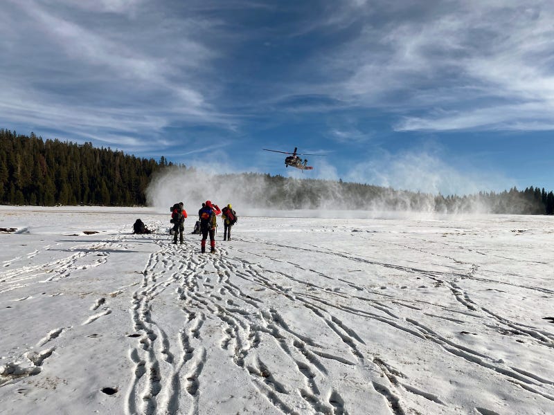 Blackhawk helicopter transporting out the search and rescue team.