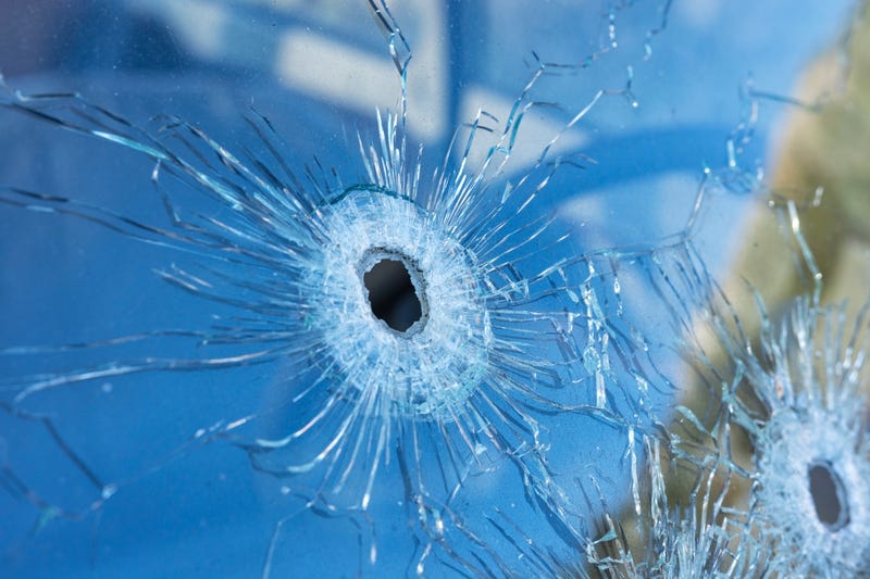 Bullet hole in car window