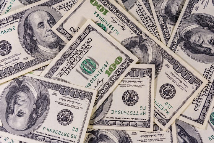 Hundred dollar bills in a pile