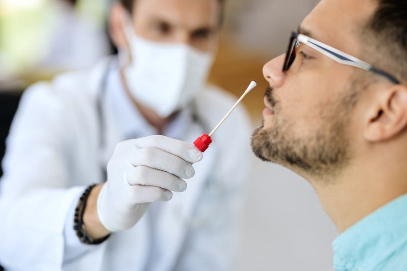 A man receives a COVID-19 test