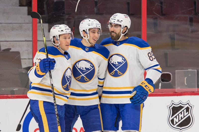 Jeff Skinner, Dylan Cozens and Alex Tuch