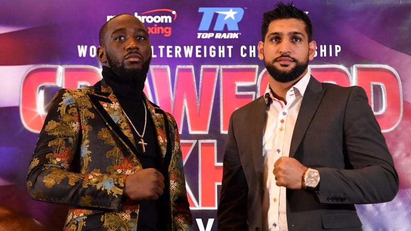 Terence Crawford and Amir Khan pose at a press conference to promote their April 20 welterweight boxing match.