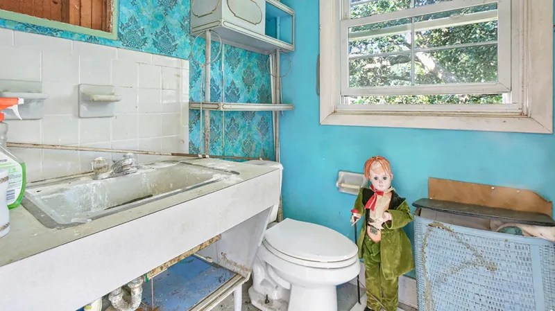 doll posed in house.