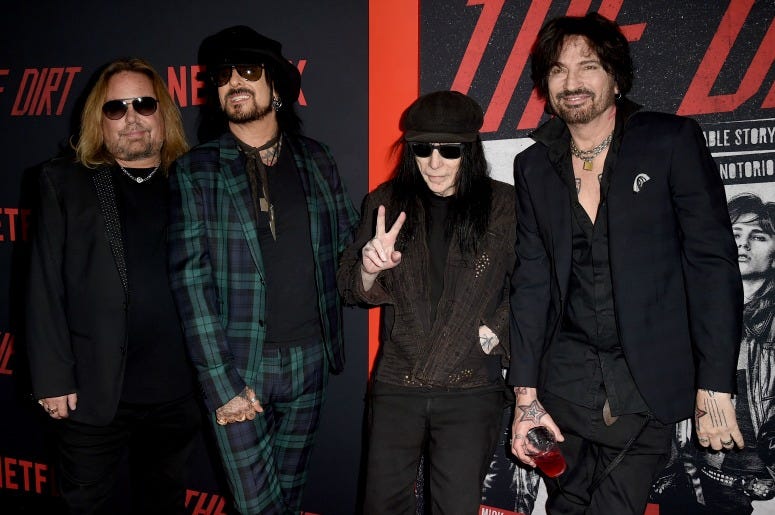 Vince Neil, Nikki Sixx, Mick Mars and Tommy Lee of Motley Crue arrive at the premiere of Netflix's "The Dirt"