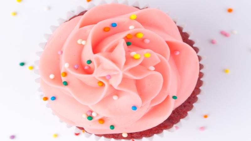 Pink sprinkle cupcake close-up Getty Images