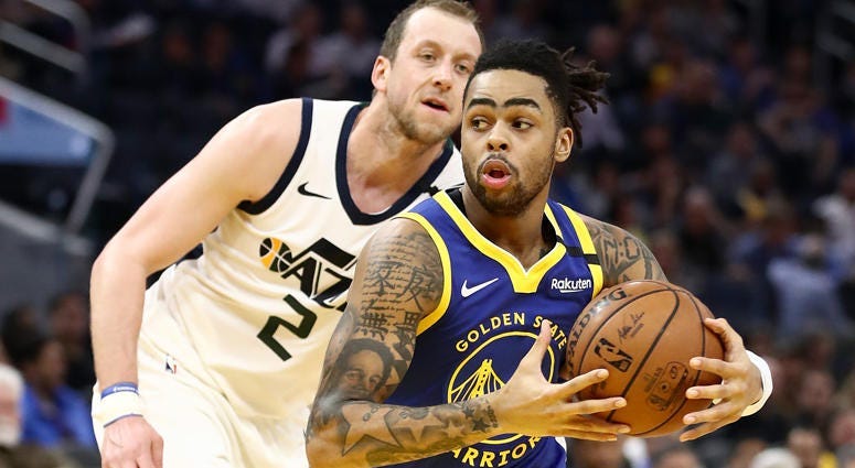 D'Angelo Russell of the Golden State Warriors drives on Joe Ingles of the Utah Jazz on Jan. 22, 2020, at Chase Center in San Francisco.