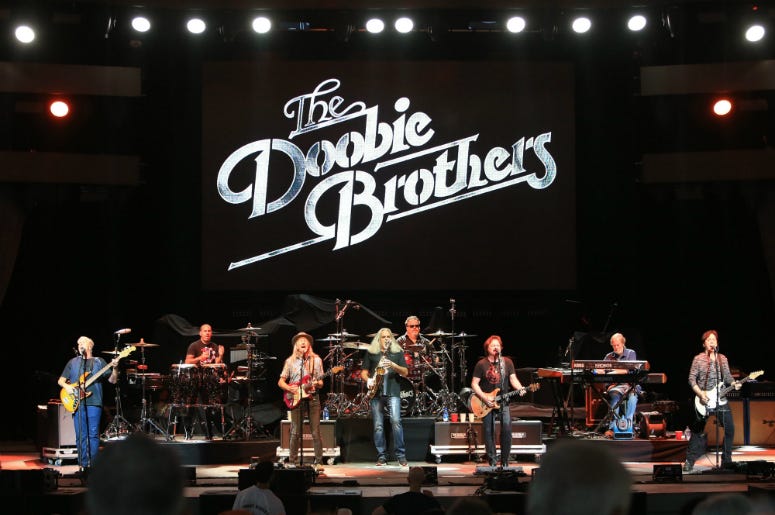 The Doobie Brothers perform at the 50th anniversary celebration of the Woodstock Festival at Bethel Woods Center for the Arts