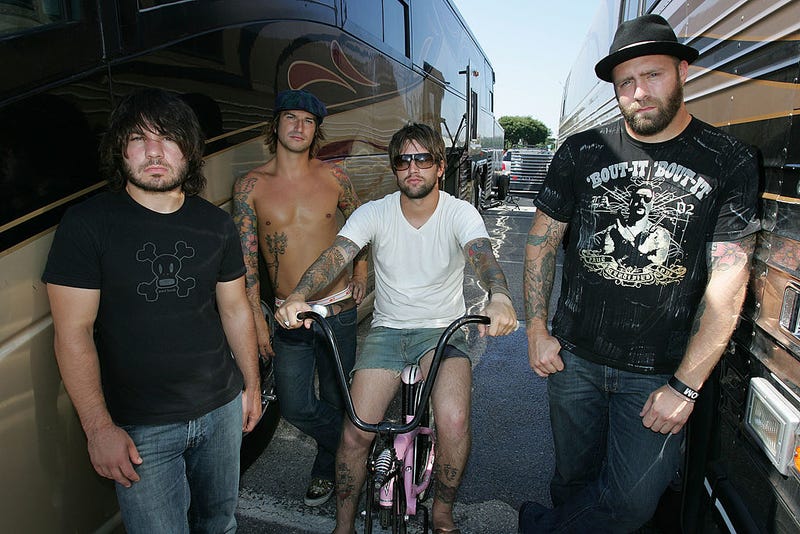 Musicians Jordan Buckley, Michael Novak Jr., Keith Buckley and Chris Byrnes of the band Every Time I Die pose backstage at the Vans Warped Tour on August 5, 2006 in Uniondale, New York