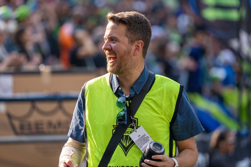 Smiling photographer at Sounders FC match against San Jose October 9th, 2022.