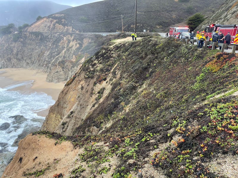 The scene after a vehicle fell over the side of a cliff along Highway 1.