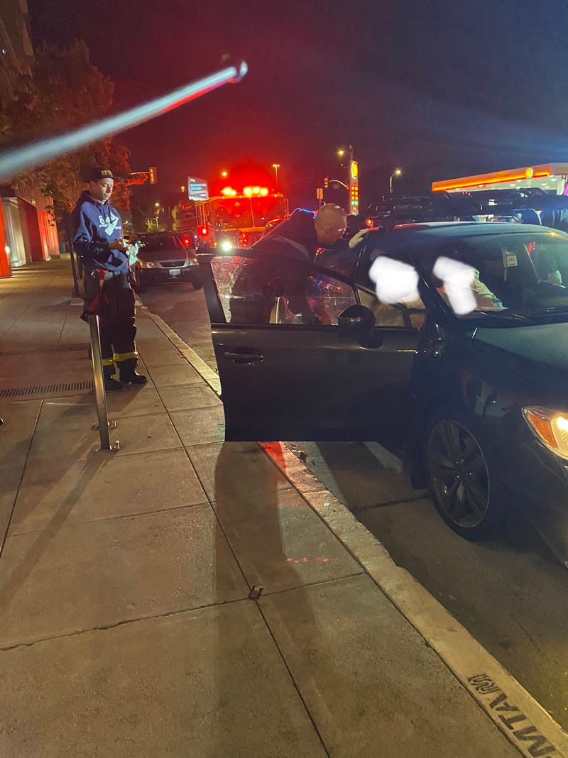 The city officials teamed up to deliver twins in the back of the car.
