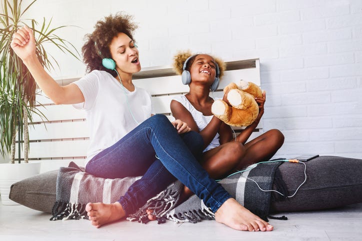 mother and daughter with headphones in
