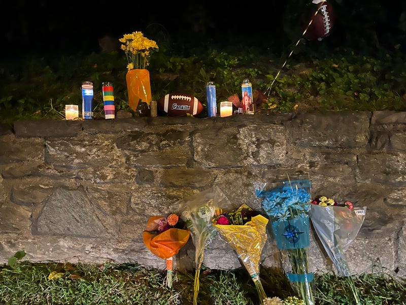 A memorial by the shooting scene at Roxborough High School where a 14-year-old boy was killed and four others were shot Tuesday afternoon.