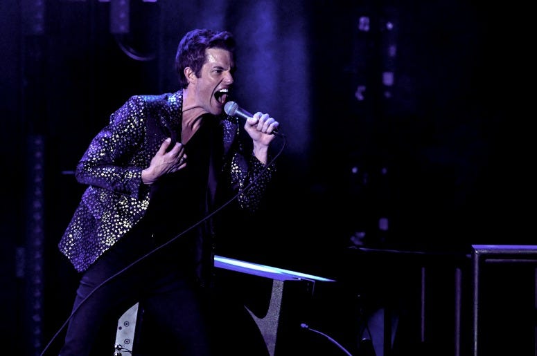 Brandon Flowers of The Killers performs on stage