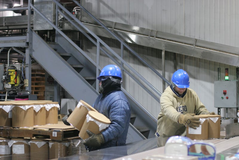 Workers at Perry's Ice Cream in Akron, NY palletizing ice cream in the freezer, which is a minus 18 degree room.