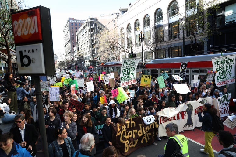 SAN FRANCISCO, CALIFORNIA - MARCH 15: Protesters carry signs as they march during the Youth Climate Strike on March 15, 2019 in San Francisco, California.