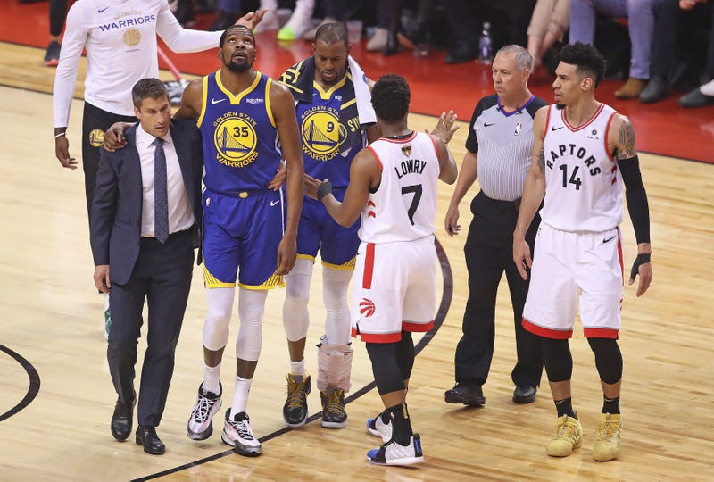 Kevin Durant limps off the court in Game 5 of the NBA Finals.