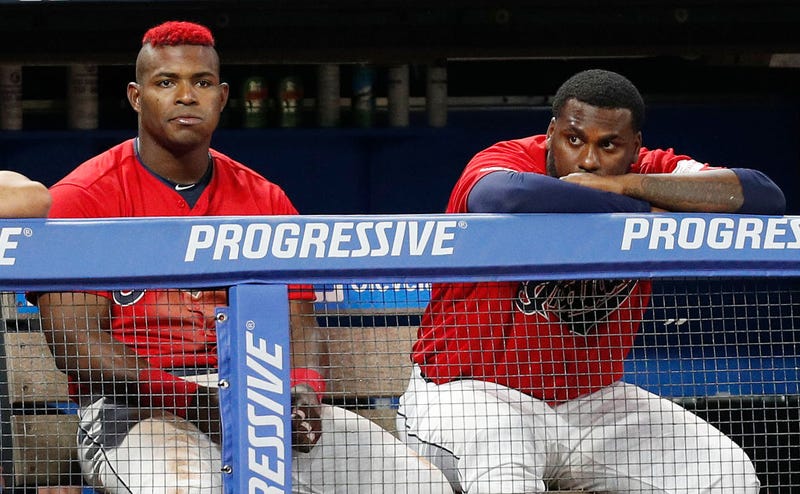 CLEVELAND, OH - AUGUST 01: Yasiel Puig #66 and Franmil Reyes #32 of the Cleveland Indians watch from the dugout in the eighth inning against the Houston Astros at Progressive Field on August 1, 2019 in Cleveland, Ohio. The Astros defeated the Indians 7-1.