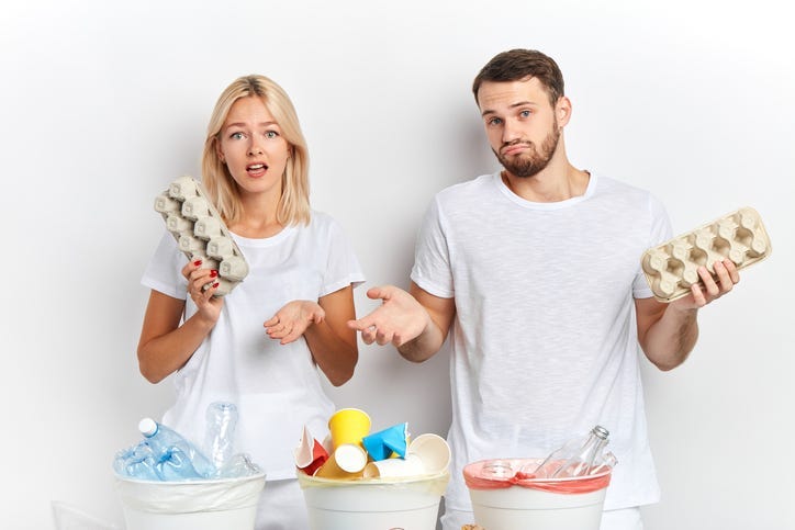 woman and man confused about recycling