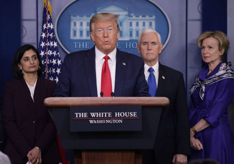 Flanked by members of the Coronavirus Task Force, U.S. President Donald Trump speaks during a news briefing on the latest development of the coronavirus outbreak.
