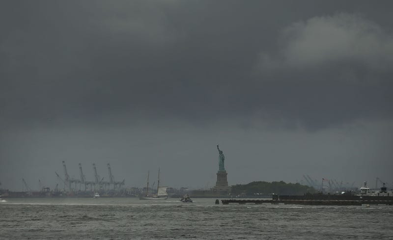 The Statue of Liberty stands in New York Harbor on a rainy and windy afternoon on July 25, 2018 in New York City.