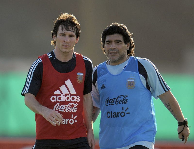 Argentina's football team coach Diego Maradona speaks with forward Lionel Messi (L) during a training session in Ezeiza, Buenos Aires on March 24, 2009.