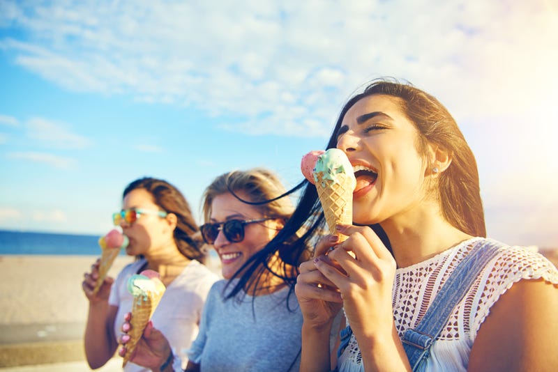 girl friends eating ice cream for dessert