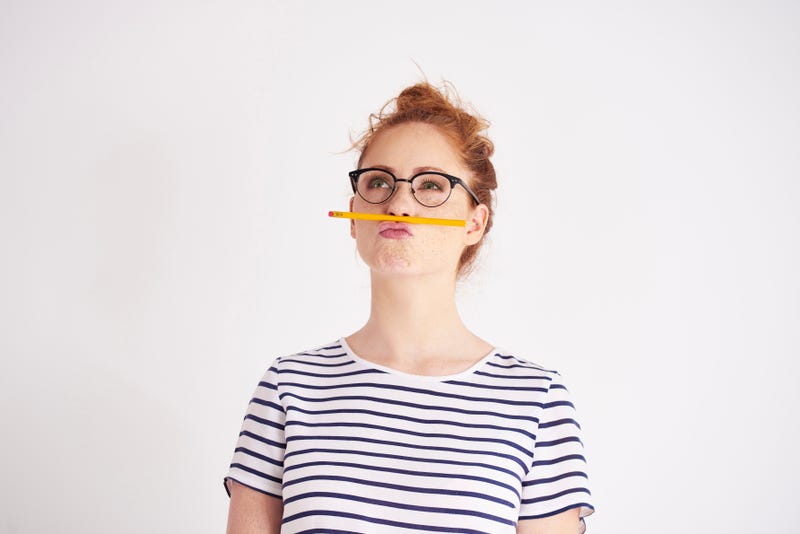 student balancing pencil on her lip