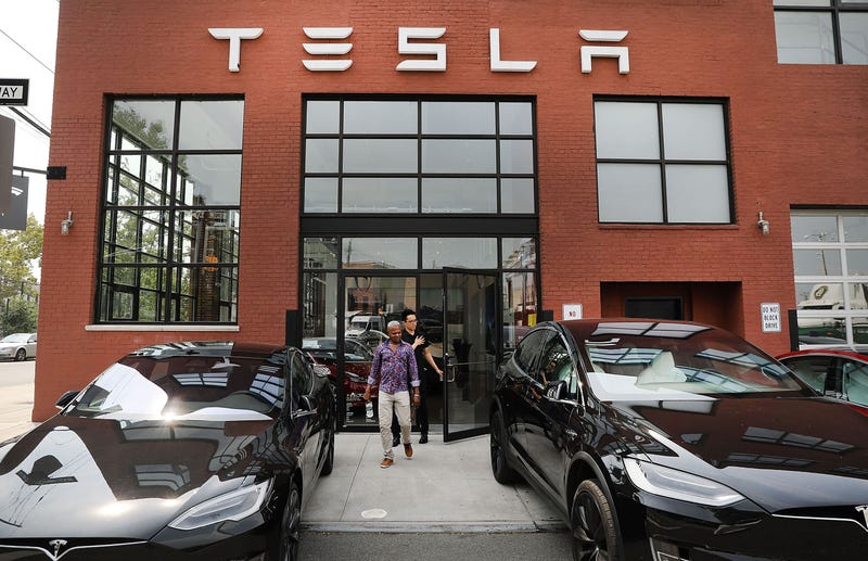 Tesla vehicles stand outside of a Brooklyn showroom and service center on August 27, 2018 in New York City.