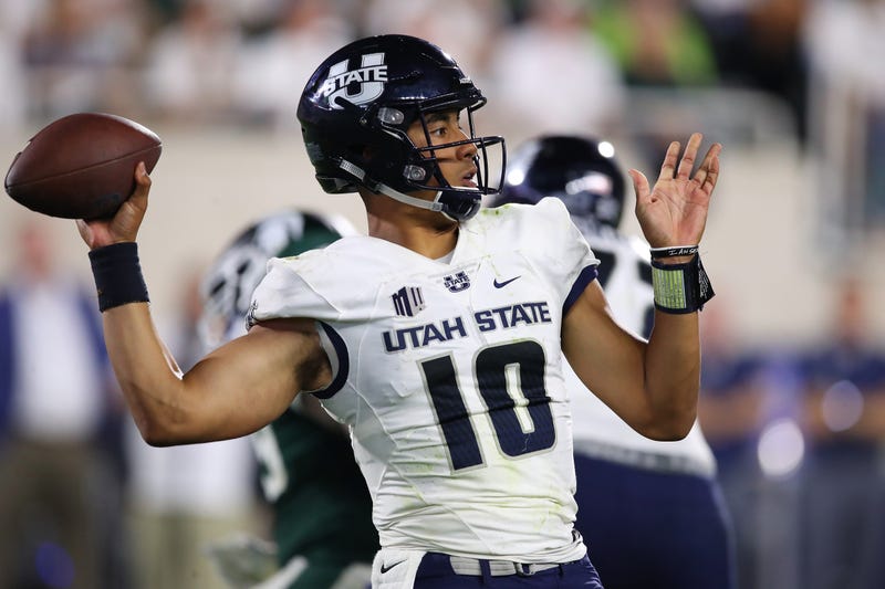 Utah State's Jordan Love fires off a pass