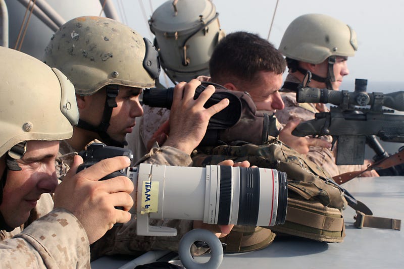 In this handout from the U.S. Navy, U.S. Marine Corps snipers provide cover and observation during a boarding and seizure operation to retake the motor vehicle Magellan Star from suspected pirates on Sept. 9, 2010 in the Gulf of Aden.