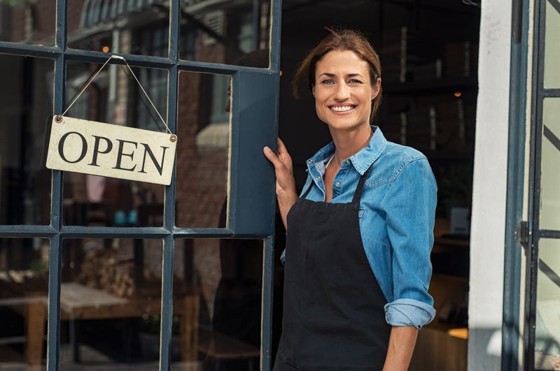 woman at door of business