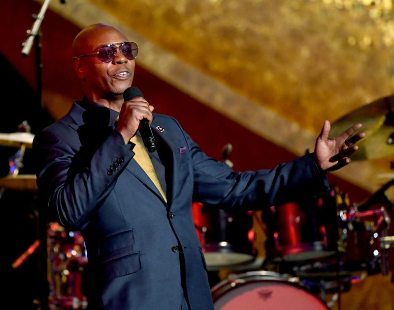  Dave Chappelle speaks onstage at Q85: A Musical Celebration for Quincy Jones at the Microsoft Theatre on September 25, 2018 in Los Angeles, California. (