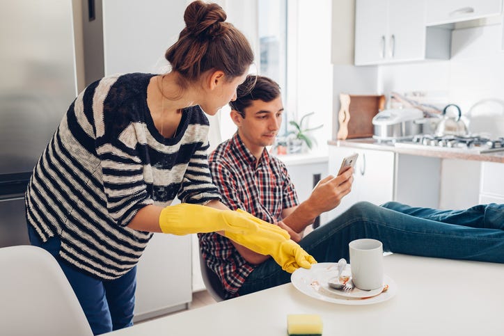 Woman cleaning up after her boyfriend