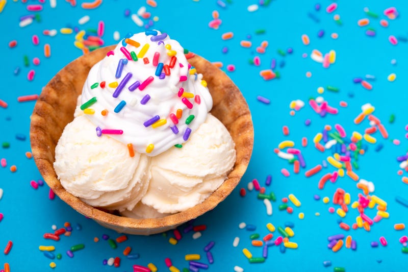 A bowl of ice cream topped with sprinkles