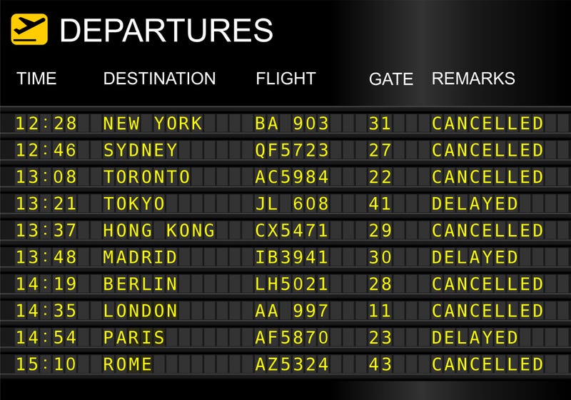 An airport schedule board noting cancelations and delayed flights