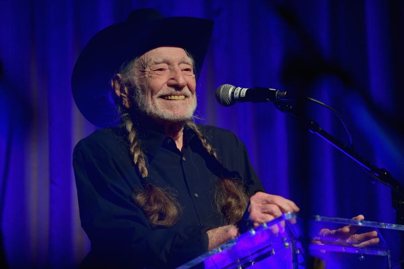 willie nelson speaks on stage at the 61st annual grammy awards